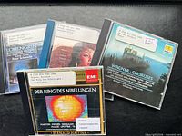 All four CDs laid out showing front covers and library labels