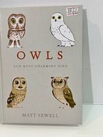 Front cover showing title, author and four illustrated owls