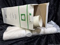 Box opened showing stacked paper portion cups and additional sleeve