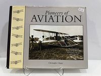 Front cover with dust jacket displayed on stand