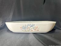 Side profile showing floral decal and overall shape