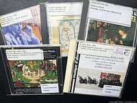 All five CDs laid out showing cover art and library labels