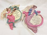Front view of both resin angel wall plaques