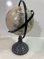 Full view of globe showing meridian rings and base