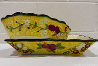 Side view of nested rectangular and oval bakers displaying exterior Fresh Crop pattern