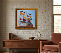 Framed Meadow Gold neon sign print mounted on wall in styled room