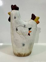 front view ceramic chicken figurine showing paint and distressing