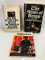 All three books front covers visible