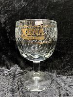 Front view of goblet showing logo and lattice pattern