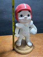 Front view showing full figure and tape measure indicating 13 in height