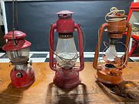 Three red lanterns displayed on table