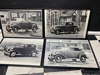 All four framed automobile photo prints side by side