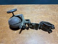 Side view of bell with full mount hardware visible