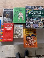 Five books laid out showing covers and titles