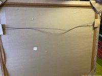 Rear view showing hanging wire and frame construction