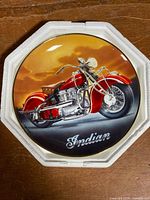Front view of plate showing motorcycle artwork and Indian logo