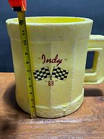 Front view with tape measure showing height and graphic