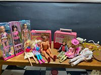 Group shot showing all boxed dolls, loose dolls, lunch cases, cooler and bicycle