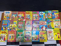 Full lot of vintage 50¢ digest comics laid out in three rows
