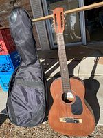 Front view of Vibra 1911 parlour acoustic guitar with gig bag
