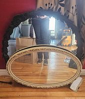 Group view of both mirrors, oval cream and round black