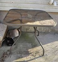 Full view of square glass patio table