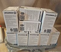 Stack of Sylvania Smart+ bulb boxes showing quantity