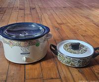 Slow cooker and saucepan side by side