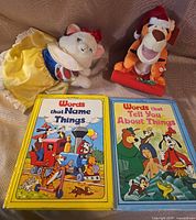 Lot overview: both plush toys and both books visible