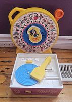 Front view of Mickey ABC See 'n Say and Fisher-Price Record Player