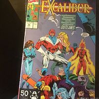 Angled view of front cover showing title, characters, issue number 36 and price