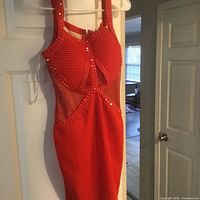 Front view of red studded mesh-panel dress