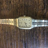 Close-up of watch face, case and part of bracelet