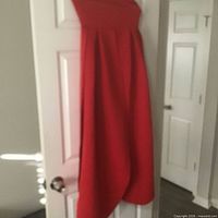 Full view of red dress hanging on door