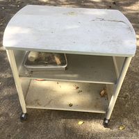 Front view of rolling cart showing shelves and casters