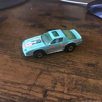 Side and top view of teal Hot Wheels Camaro