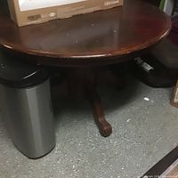 Full view of round oak pedestal dining table