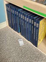 Row of blue Beethoven Centennial Collection binder sets on shelf with lot tag visible