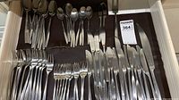 Drawer view showing full assortment of forks, knives, spoons and serving fork