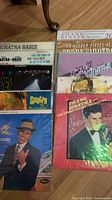 Group view of all LPs laid out, showing multiple Frank Sinatra titles including two Sinatra-Basie copies, 20 Golden Pieces and others