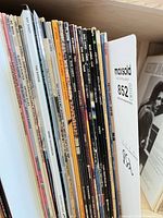 Stack of approximately 22 LPs showing varied spines, indicating jazz/instrumental titles