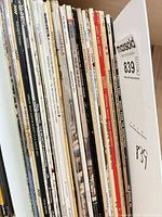 Row of vinyl LP spines displaying multiple soundtrack titles