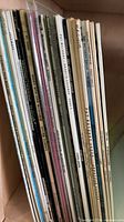 Stack of vinyl LP spines showing quantity