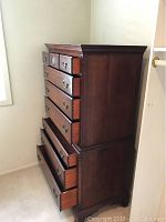 Full side view showing overall dresser structure, drawer count, and wear on finish.