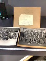 Overview of two mounted photos and caption note