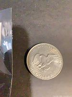 Reverse of 1971 Eisenhower dollar showing eagle landing on moon