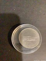 Reverse of coin showing Province House and dates 1873-1973 inside capsule