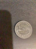 Obverse view showing legend and central design