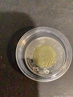 Reverse of 2018 Armistice $2 coin in capsule