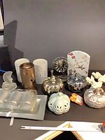 Full lot overview showing pumpkins, candleholders, clock, stakes, votive set